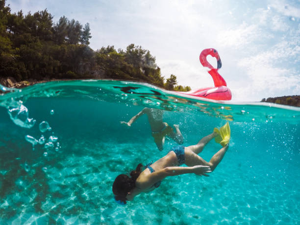 istock Child Having Fun In Crystal Clear Sea Water 1485171355