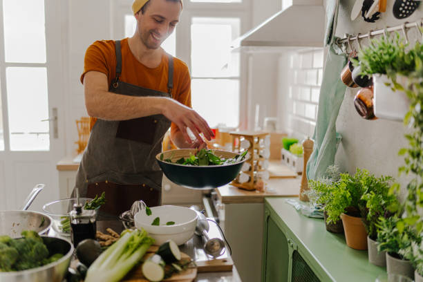 istock Young chef crafting a delicious salad 1485173163