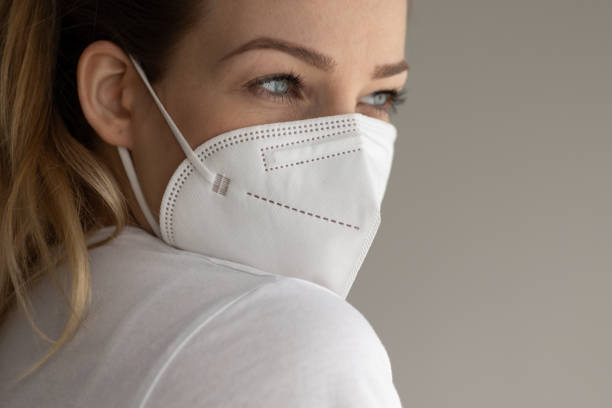 istock Young woman wearing a face mask during coronavirus and flu outbreak 1485173318