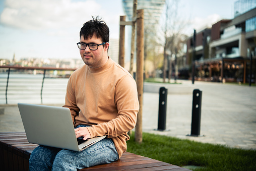 Young man runs his business outdoors