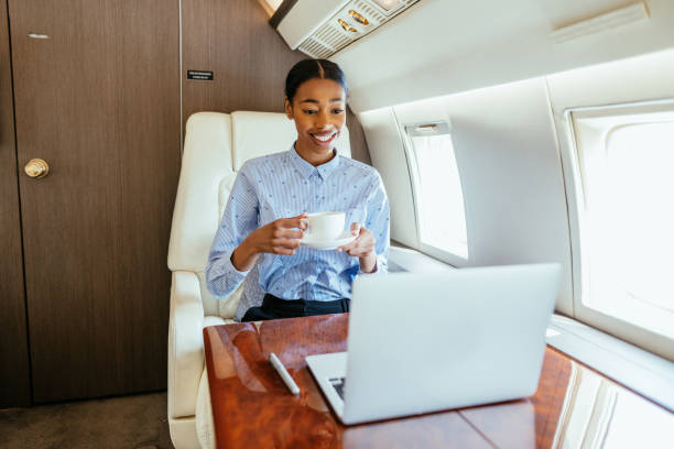 istock African businesswoman flying by private airplane and using laptop for work 1485180322