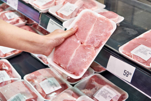 istock Pork steak in hands buyer in store 1485188292