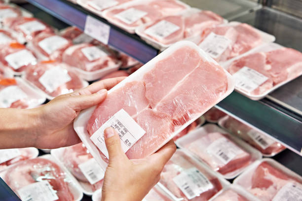 istock Pork steak in hands buyer in store 1485188439
