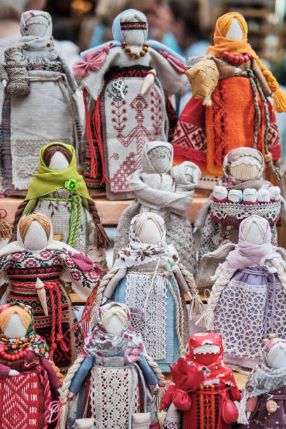 Slavic traditional little dolls made of rags Slavic traditional little dolls made of rags - amulets associated with pagan traditions. Handmade souvenirs or gifts on market. slavic culture stock pictures, royalty-free photos & images