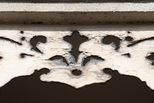 Overhead, close up shot of an architectural detail on an old building.