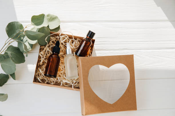 istock A gift in a cardboard eco package with cosmetics inside on a white wooden background 1485190823