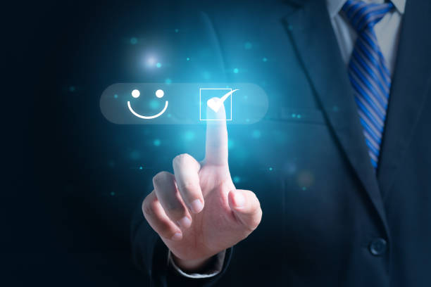 istock Businessman pressing smiley face emoticon on virtual screen 1485192778