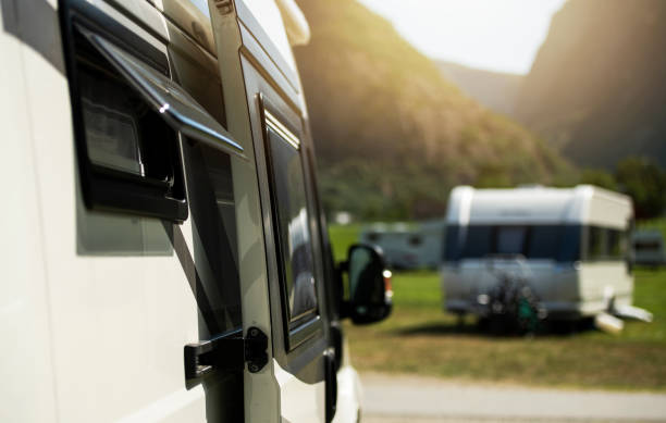 istock Class B Camper Van RV Motorhome and a Travel Trailer in a Background 1485196135