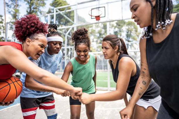 istock Friends stacking hands at sports court 1485202687