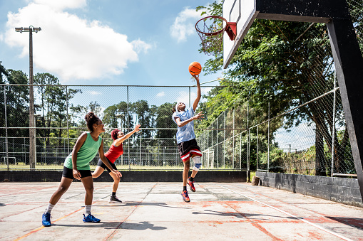 Women playing basketball