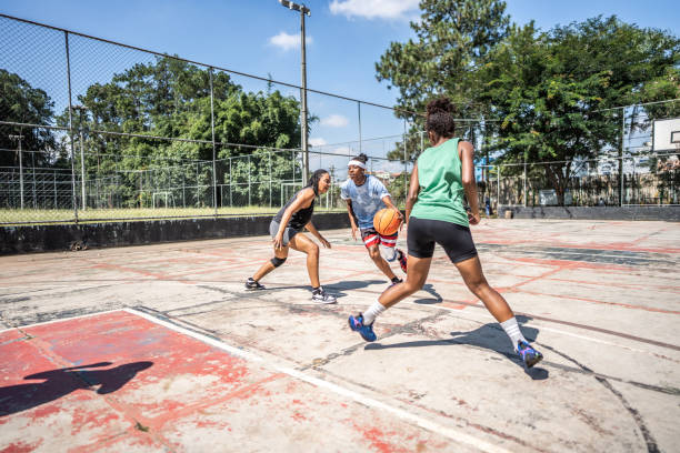 Women playing basketball