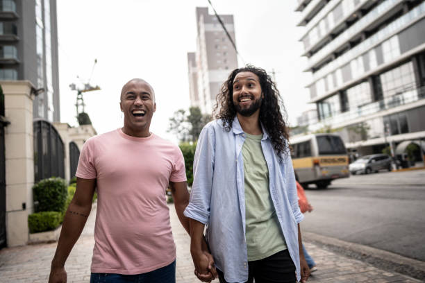 istock Gay couple talking while walking in the street 1485204189