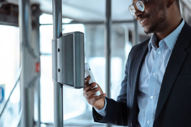 istock African-American commuter paying a bus ticket via smart phone 1485210639