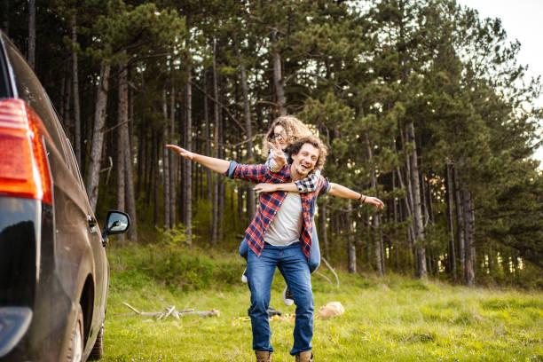 istock Young couple having fun on a meadow while men is carrying his girlfriend on his back 1485212972