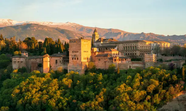 Alhambra at sunset from San Nicolas viewpoint. Sierra Nevada in the background.