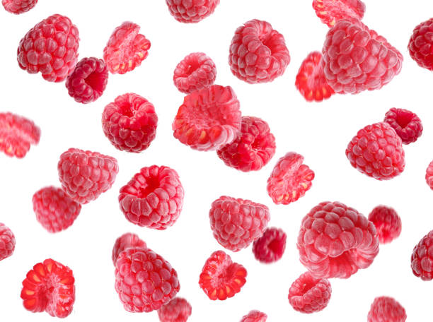 istock Delicious ripe raspberries flying on white background 1485228707