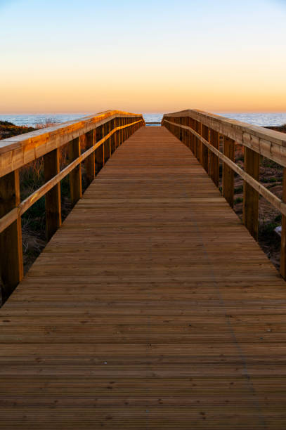 istock A bridge to the beach at sunset 1485229547