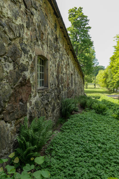 istock a large stone building with grass and trees 1485229654