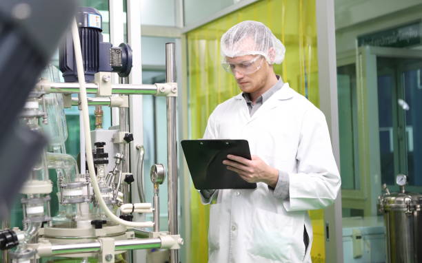 istock scientist analyzing a biological and ecological hemp plant used for herbal pharmaceutical CBD oil and THC oil in a laboratory. 1485232428