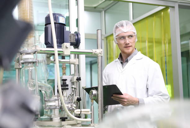 istock scientist analyzing a biological and ecological hemp plant used for herbal pharmaceutical CBD oil and THC oil in a laboratory. 1485232429