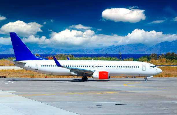 istock Airplane on airport runway under sunset view dramatic sky with evening light 1485235163