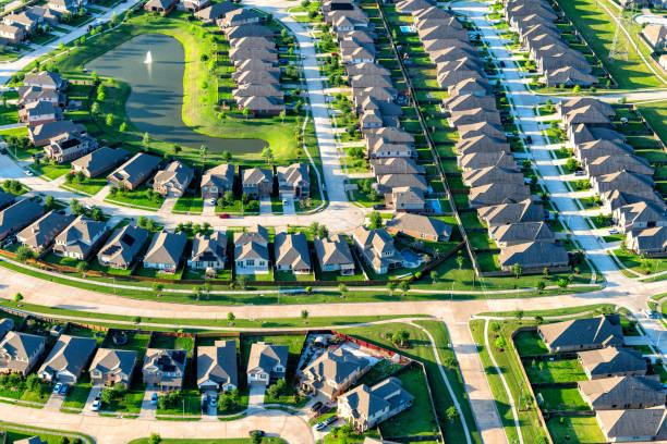 Suburban Houston Development Aerial view of a large suburban housing subdivision located just south of Houston Texas shot from an altitude of about 800 feet during a helicopter photo flight. housing development stock pictures, royalty-free photos & images