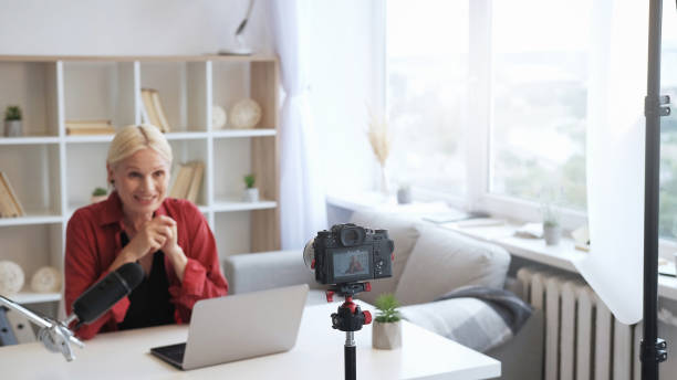 istock Content creator vlog stream senior woman camera 1485247789