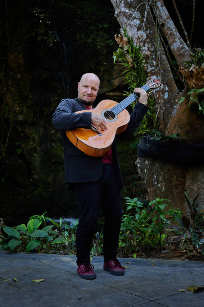 istock Acoustic guitar player delivering a captivating performance in nature 1485247977
