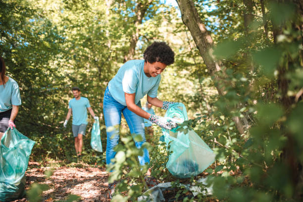 istock Good Looking Mixed Race Female Putting Away Trash 1485249816