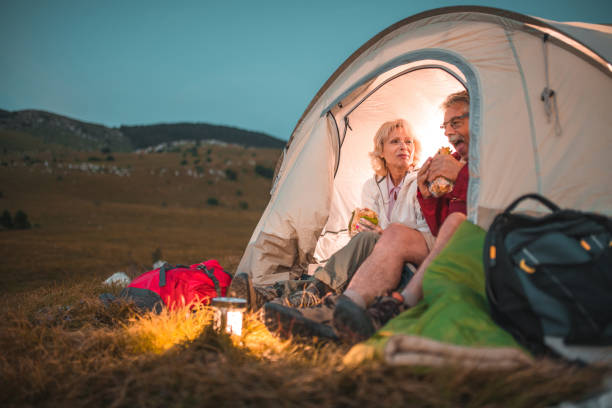 istock Active Senior Couple Resting After A Long Hiking Day 1485251506