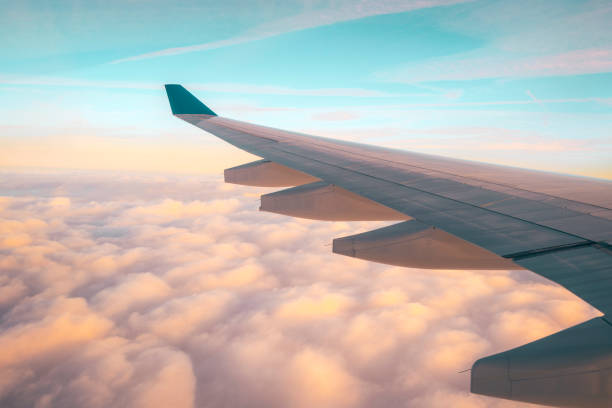 istock Tranquil sunrise cloudy sky, view from airplane window 1485252990