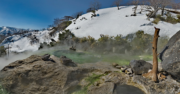 Russia. Kuril Islands. View of the baths of the thermal spring (Boiling river) near the volcano Baranovsky, the water temperature in which reaches 42 degrees.