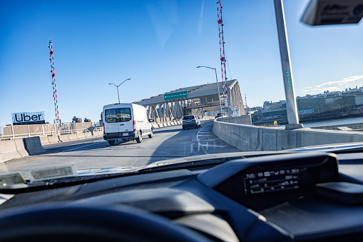 Car driver point of view approaching the Willis Avenue Bridge heading eastbound over the Harlem River from Manhattan to The Bronx on March 8, 2023. This Willis Avenue Bridge is a new swing bridge completed in 2010. It replaced the original Willis Avenue Bridge which opened in 1901. The TCS New York City Marathon crosses this bridge as part of the annual race route.