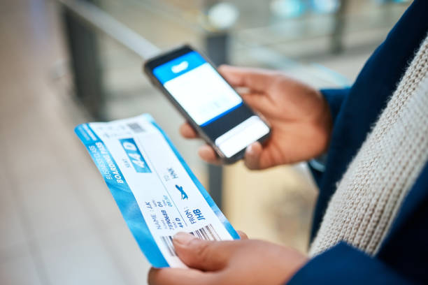 istock Plane ticket, online check and black man hands holding airplane documents and phone for flight. Digital app, networking and airport document for travel schedule with male holding barcode information 1485259903