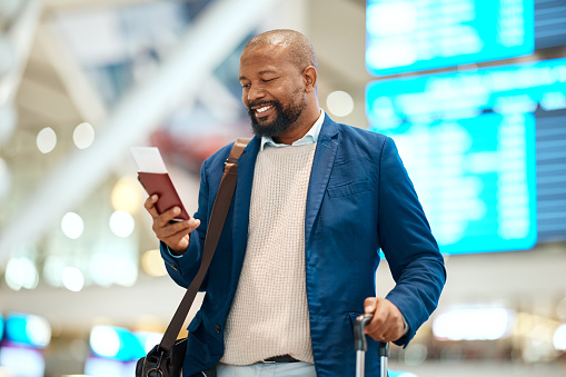 Black man in airport with passport, ticket and smile happy travelling to foreign country for business trip. Visa, travel and happy businessman waiting for flight to international destination for work