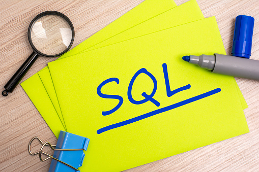 SQL - sales qualified lead - acronym text concept with blue marker on yellow card