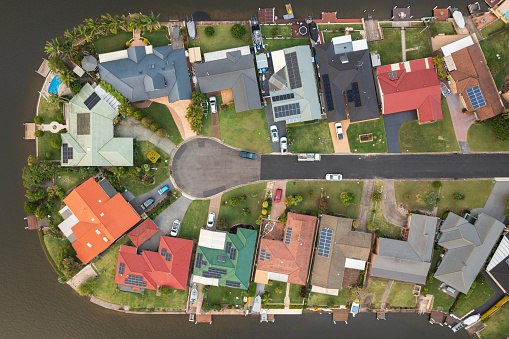 Aerial roof top view of waterfront houses at the coastal town of Forster, NSW, Australia