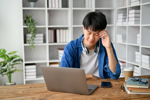 istock Asian college student sitting in the study room, preparing for the exam. 1485272498