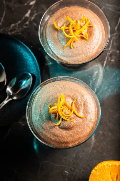 Light and airy orange chocolate mousse with decorative orange strands.