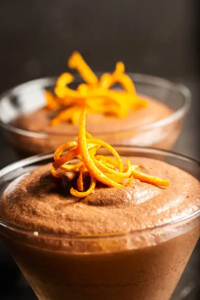 Light and airy orange chocolate mousse with decorative orange strands.