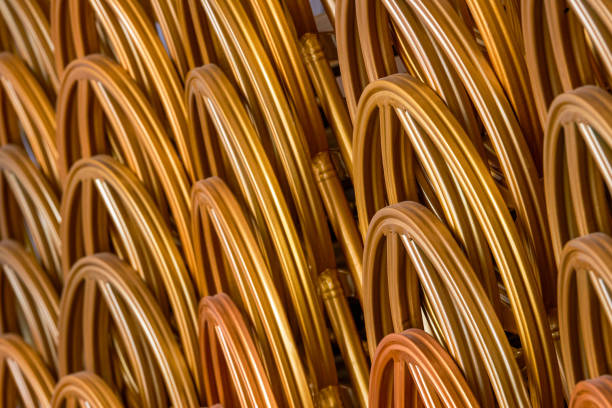istock Close-up of stacked golden stools with curved backs 1485279727