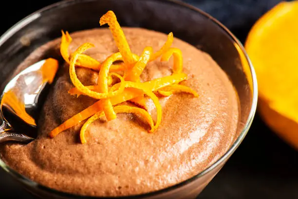 Light and airy orange chocolate mousse with decorative orange strands.