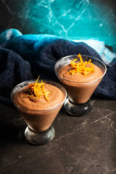 Light and airy orange chocolate mousse with decorative orange strands.