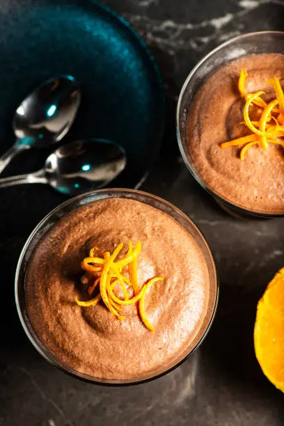 Light and airy orange chocolate mousse with decorative orange strands.