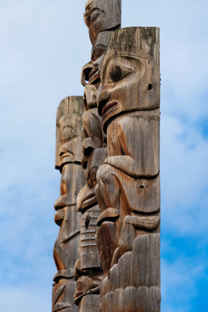 Gitksan Totem Poles, British Columbia, Canada Close up of First Nations totem poles of the Gitxsan natives in Gitanyow or Kitwancool, British Columbia. smithers british columbia stock pictures, royalty-free photos & images