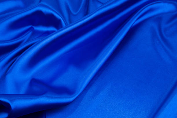 istock Soft folds of blue silk cloth. 1485290754