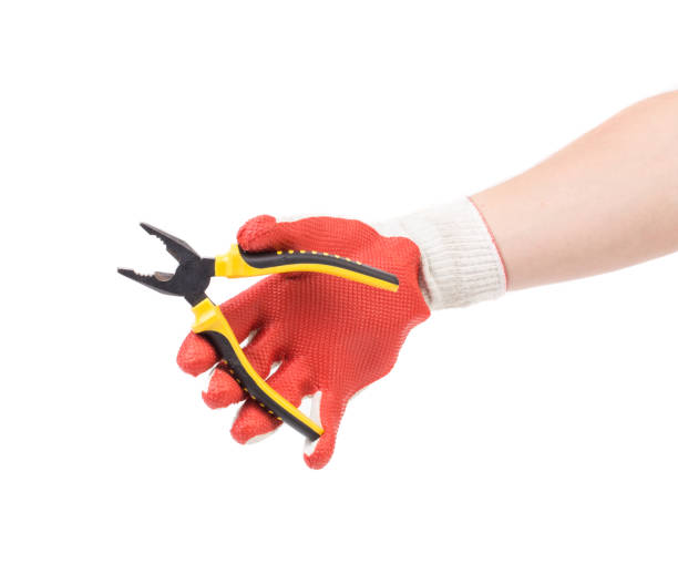 istock A gloved hand holds a pliers. 1485290819