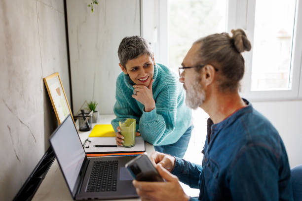 istock Mature couple using laptop at home 1485295215