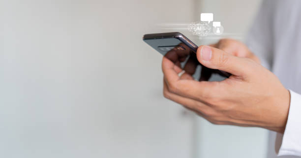 istock close up businessman hand type on smartphone to use about AI robotic chat programming to asking and get data information about innovation for future lifestyle concept 1485300971