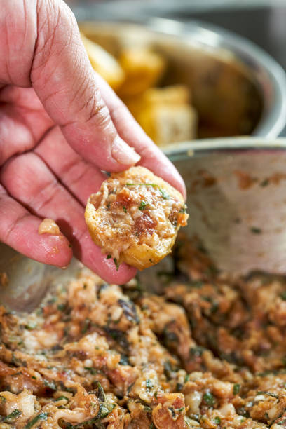 istock A chef is making China’s Guangxi traditional dish, fried tofu stuffed with meat 1485302336